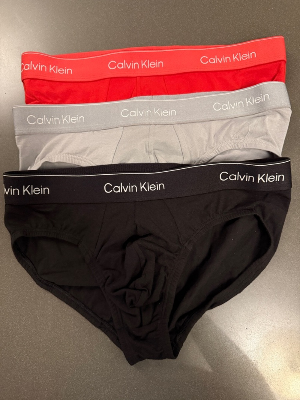 New Calvin Klein Hip Briefs Trio Red, Light Gray, Black Cotton.
